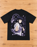 Back of a black T-shirt with a lavender and white anime-style female warrior graphic, blossoms, drifting petals and purple lettering.